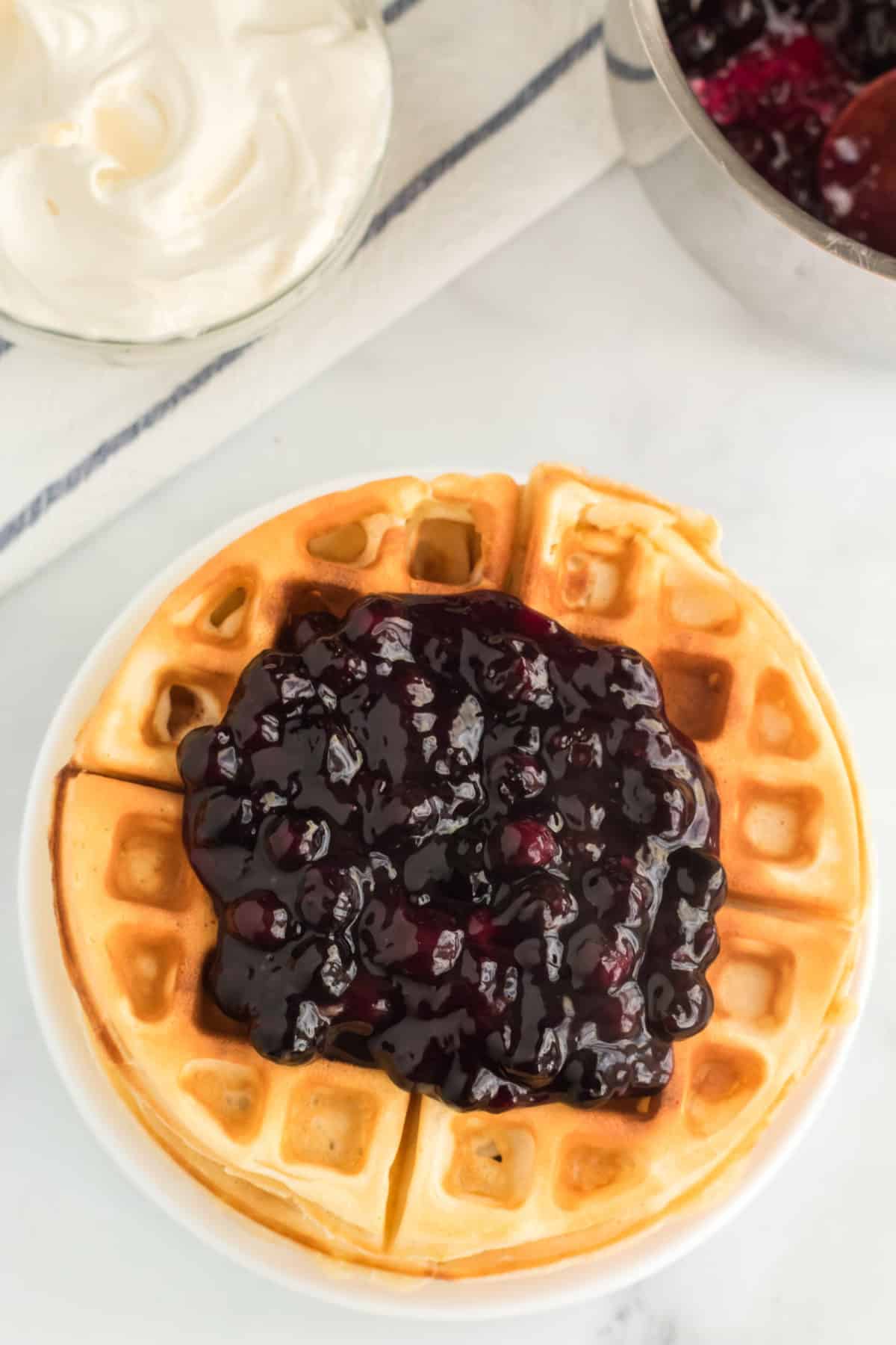 This blueberry topping is unfussy to whip up and so delicious on top of waffles, pancakes, ice cream, or any other sweet treat that you like!