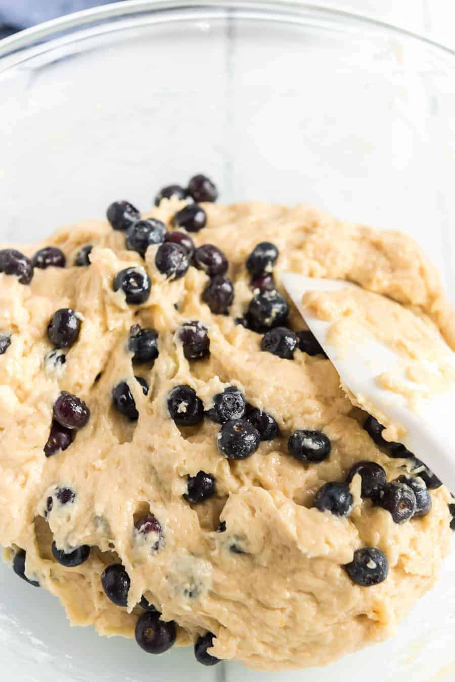 lemon blueberry muffin mix in a clear glass bowl