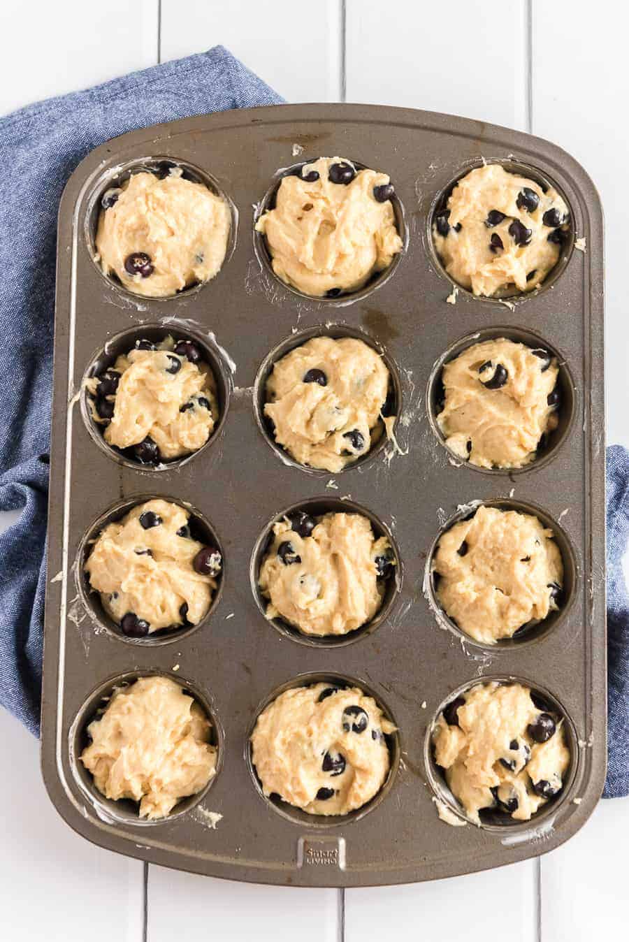 lemon blueberry muffin mix in muffin tins