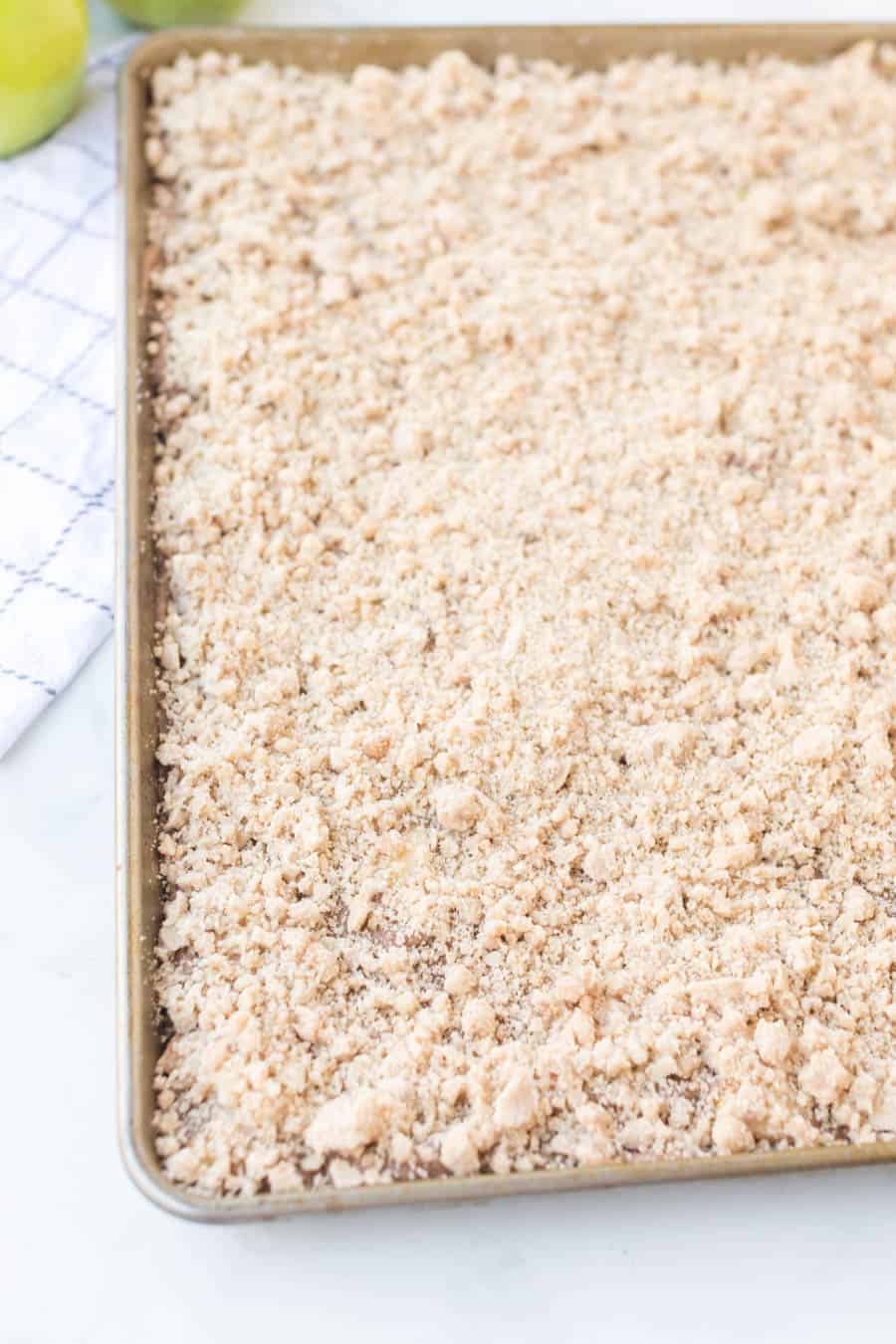 baking dish with raw apple crumble
