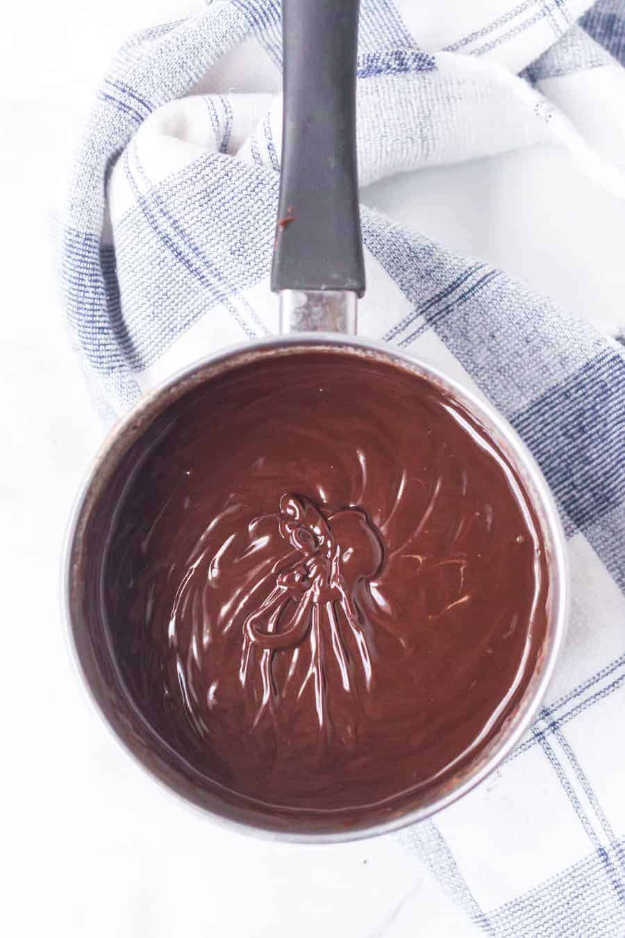 pan of dark melted chocolate from above.