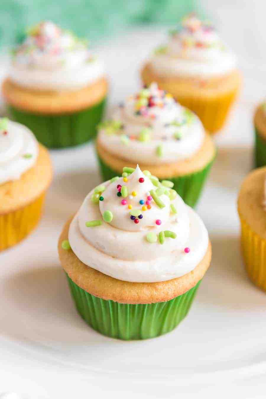 vanilla cupcakes with buttercream icing on top