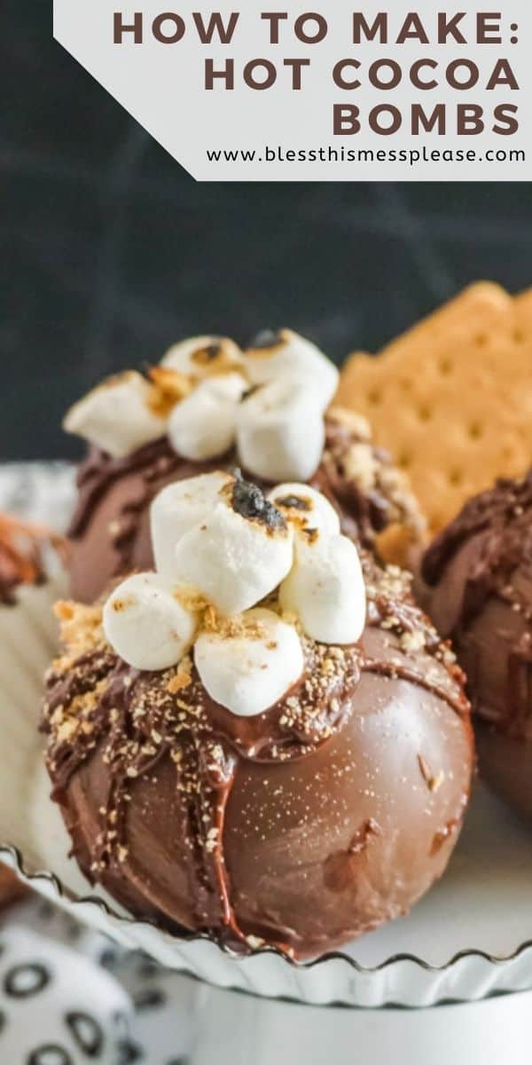 A close-up of the decorations on top of the hot chocolate bomb including toasted mini marshmallows and some graham cracker crumbs.