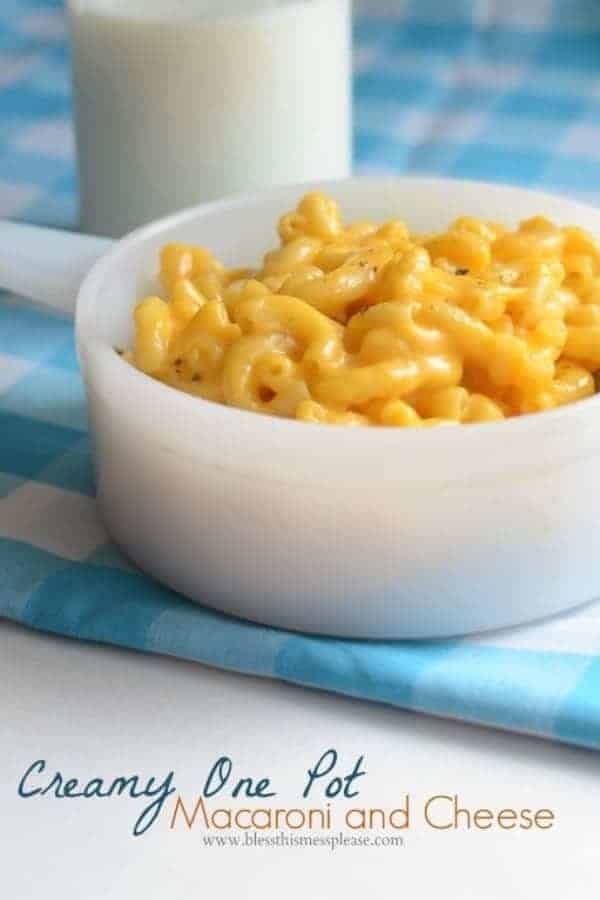 Title Image for Creamy One Pot Macaroni and Cheese and a white bowl of macaroni and cheese on a blue and white plaid cloth.