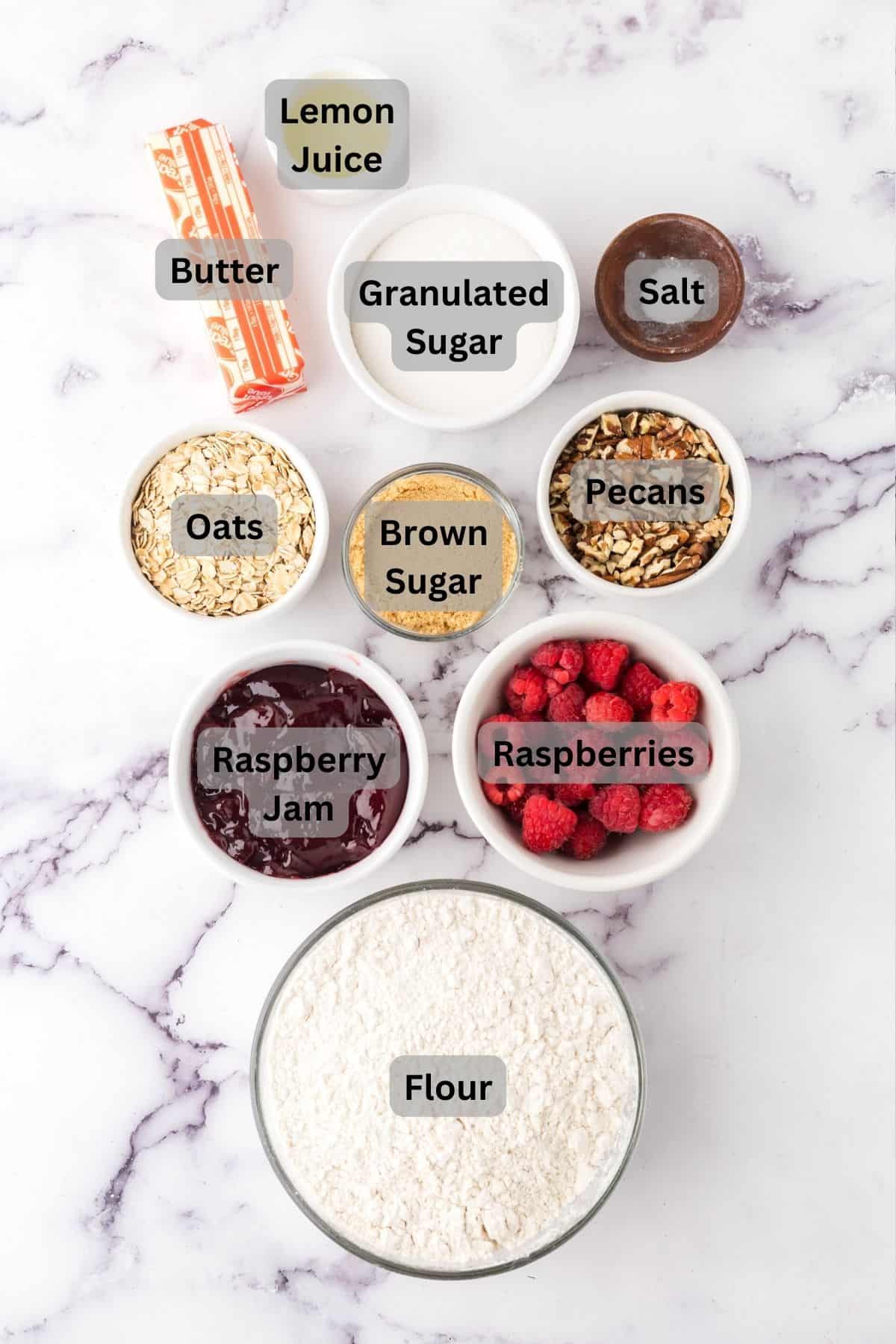 portion bowls each with raw ingredients to make raspberry strudel bars.