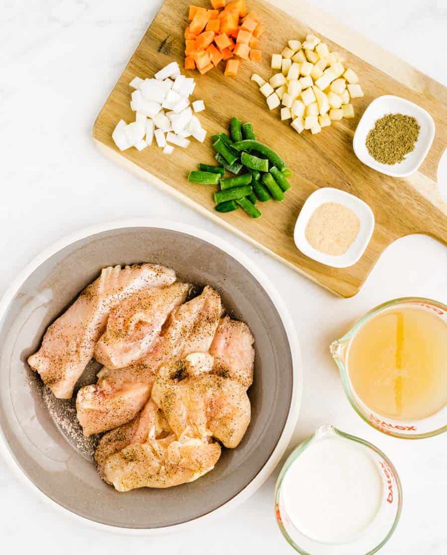 Top view of ingredients for slow cooker chicken pot pie in individual bowls.