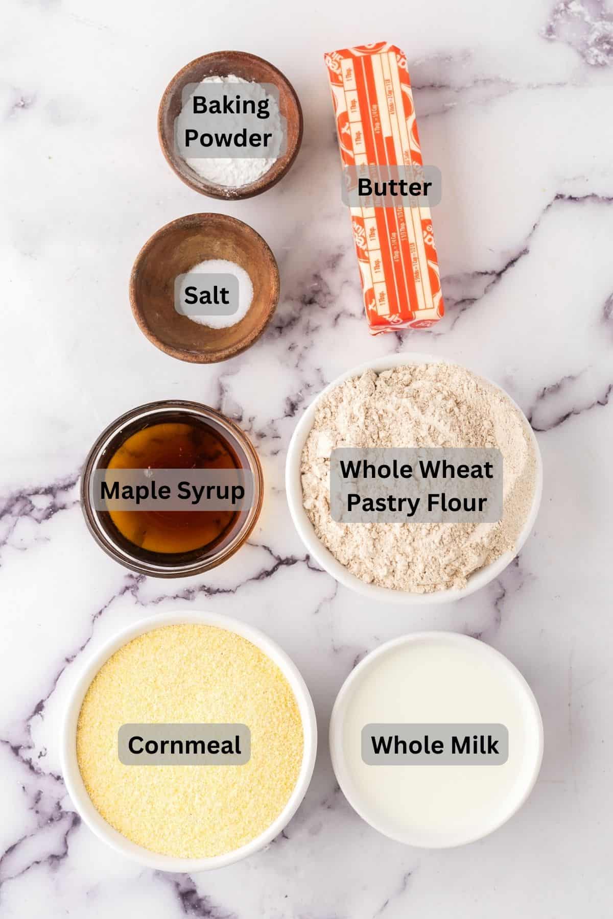 Ingredients in bowls that are digitally labeled for maple cornmeal biscuits.