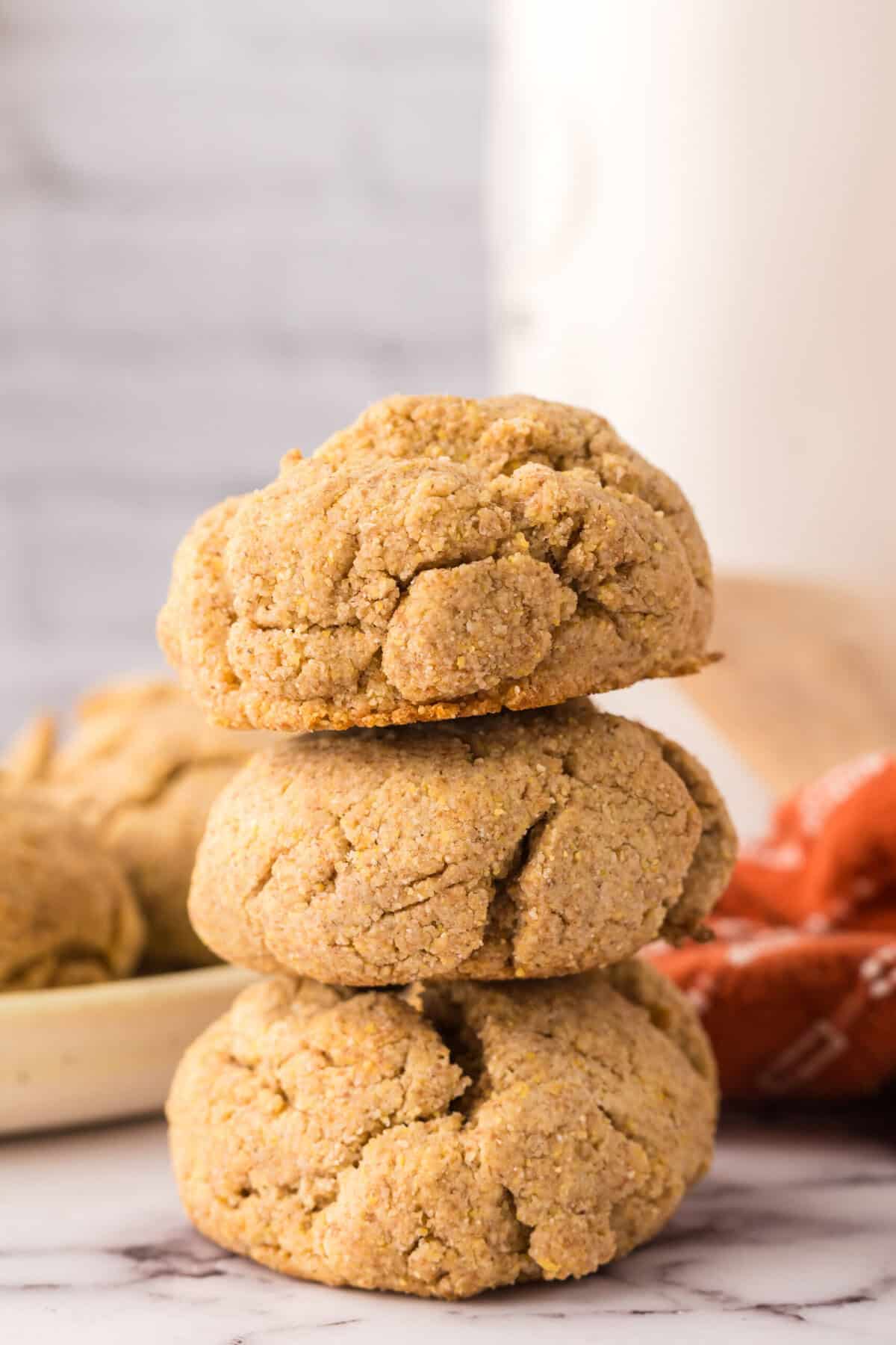 3 maple cornmeal biscuits stacked.