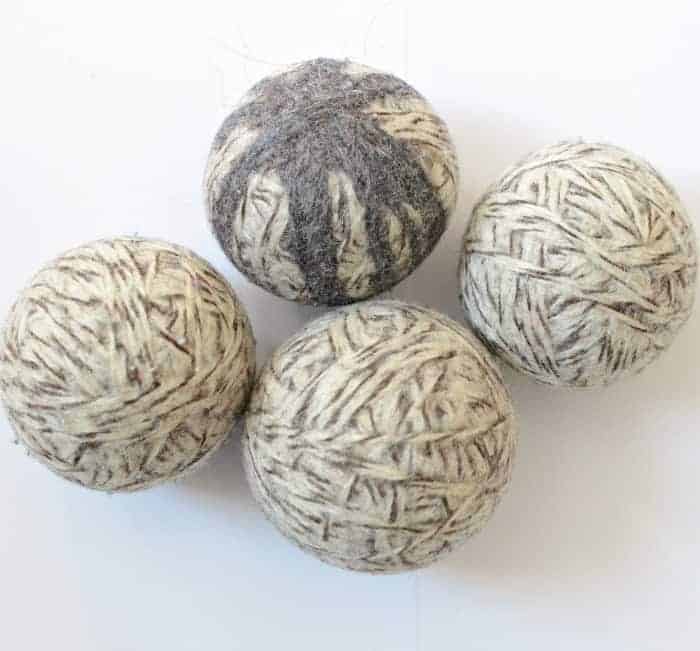 Four felted wool dryer balls after felting.
