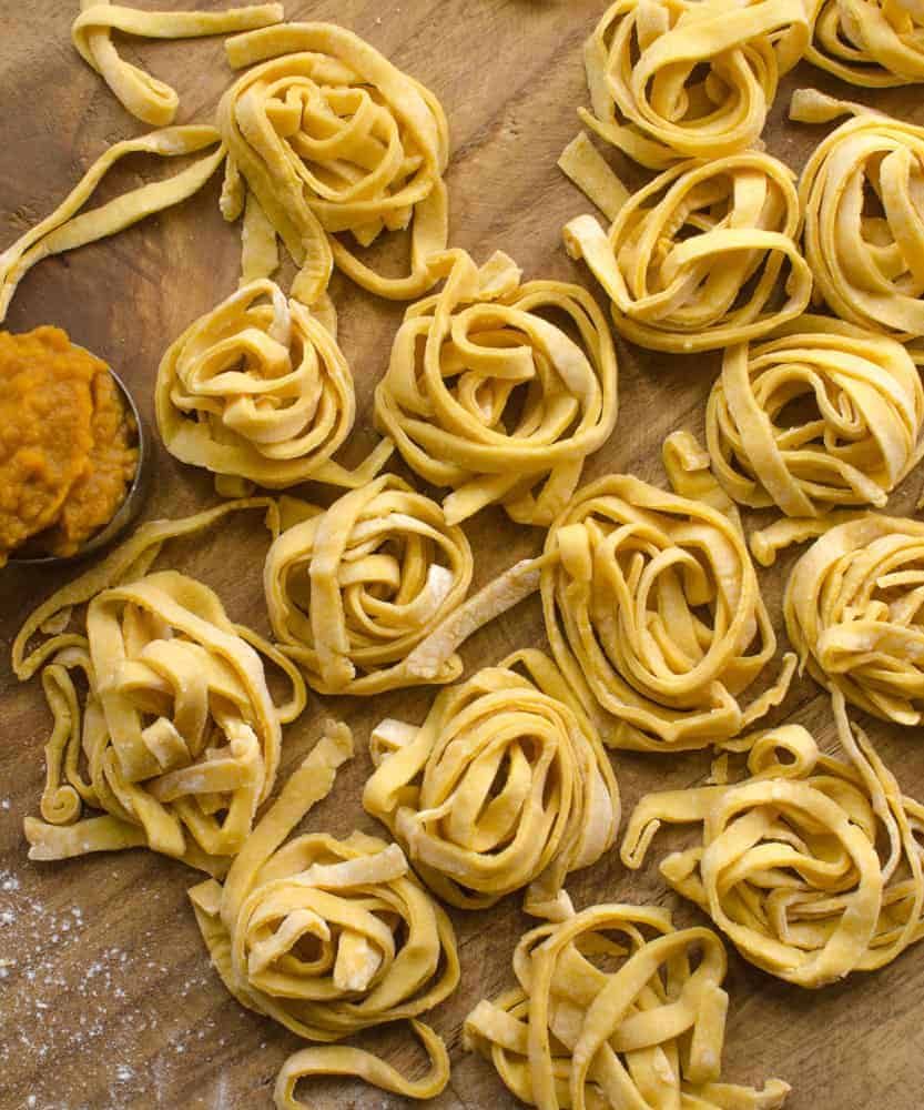Simple homemade pumpkin noodles that are fun to make and fun to eat. The pumpkin flavor is subtle, but the orange color is gorgeous!