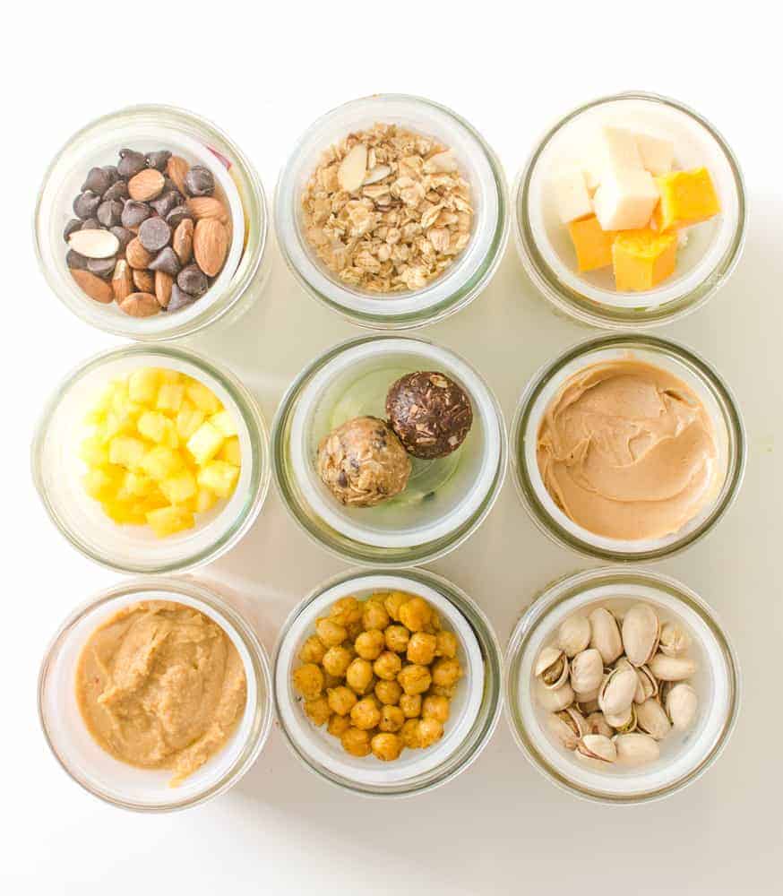 10 Healthy Snacks in Mason jars and divider cups.