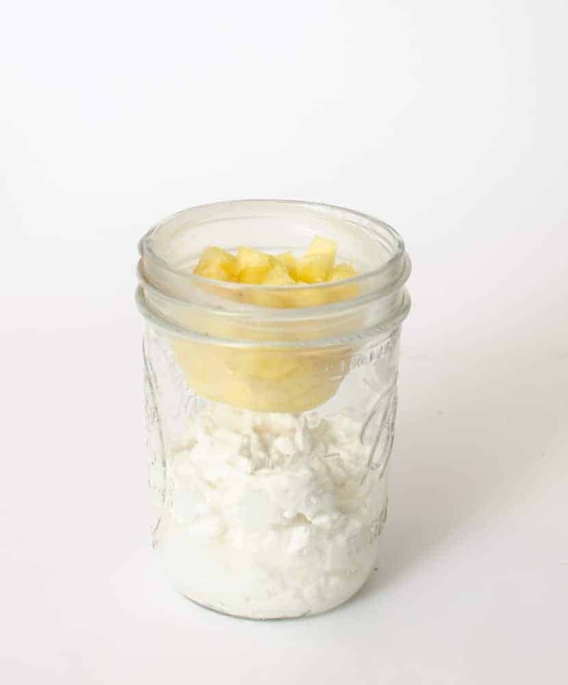 Cottage cheese and fruit in a Mason jar.