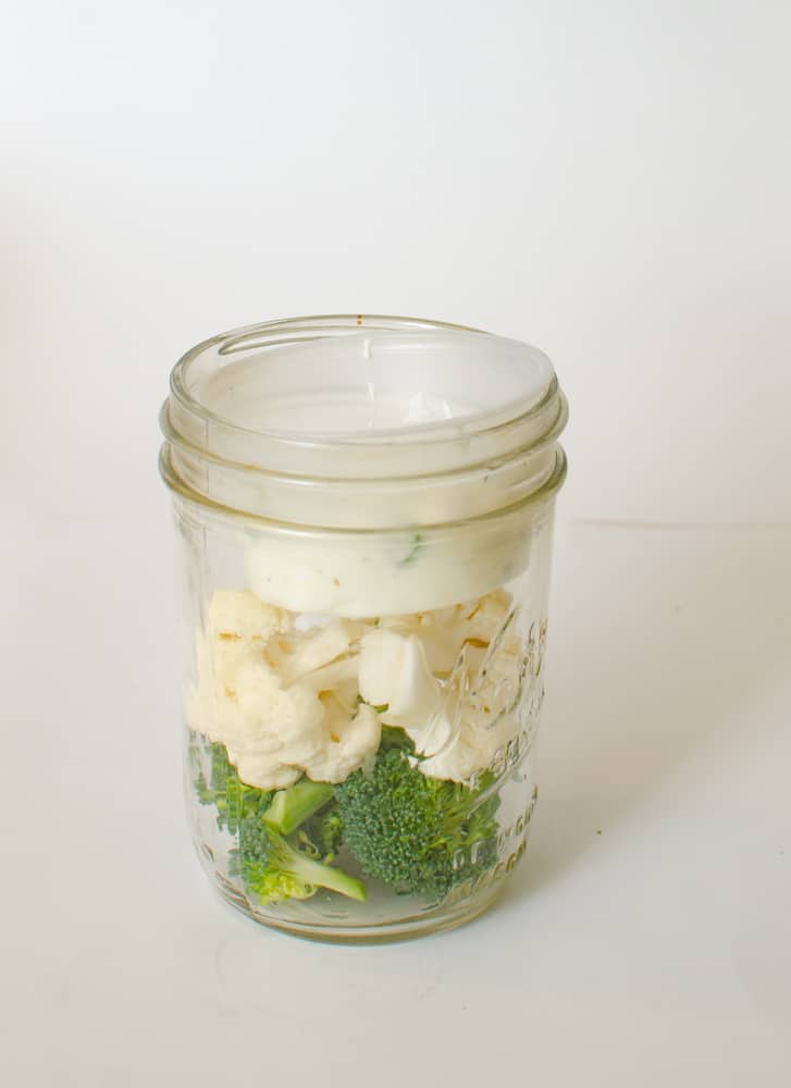 Cauliflower and Broccoli with Dip in a Mason jar.