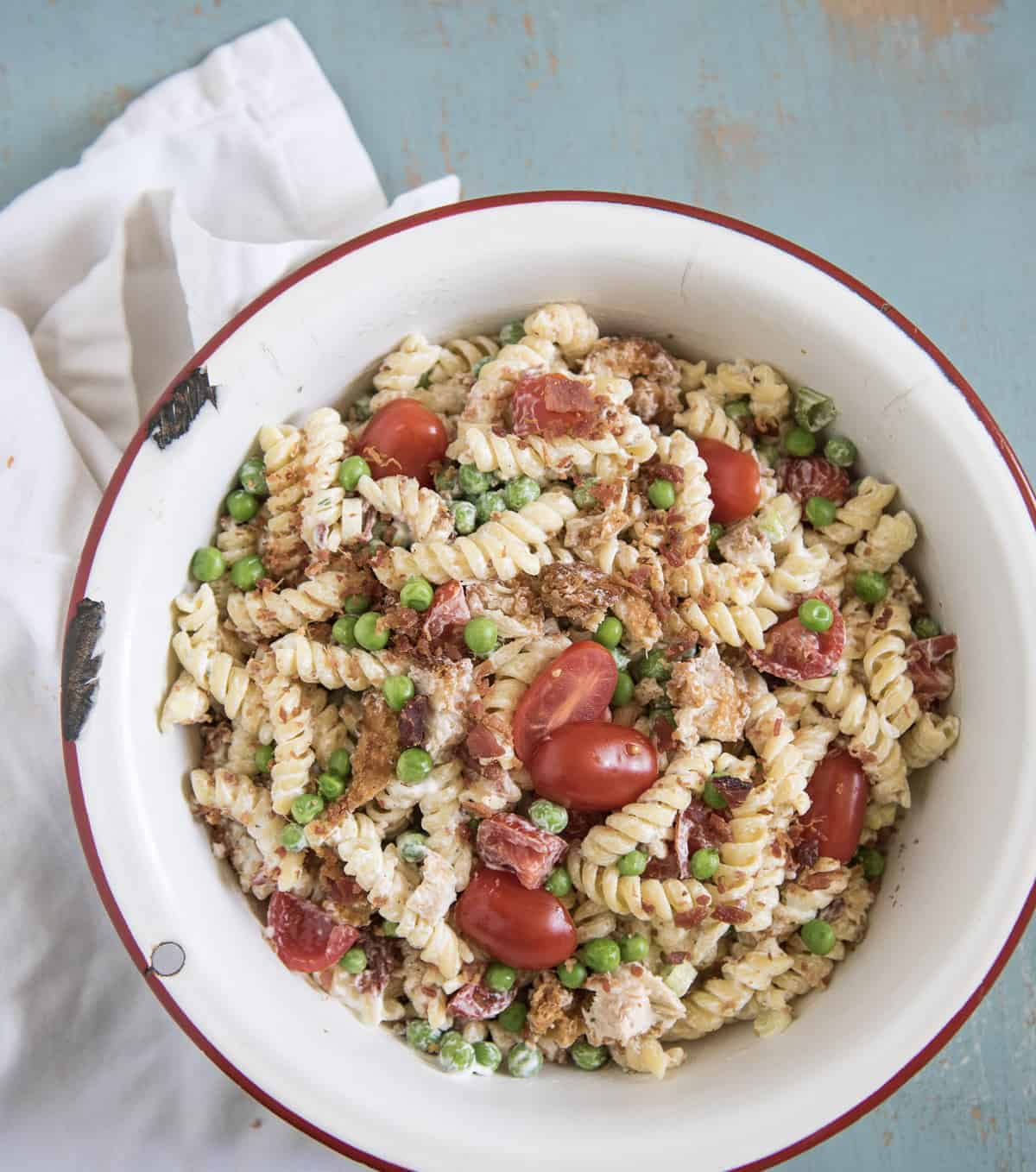 a large bowl of chicken bacon ranch pasta salad
