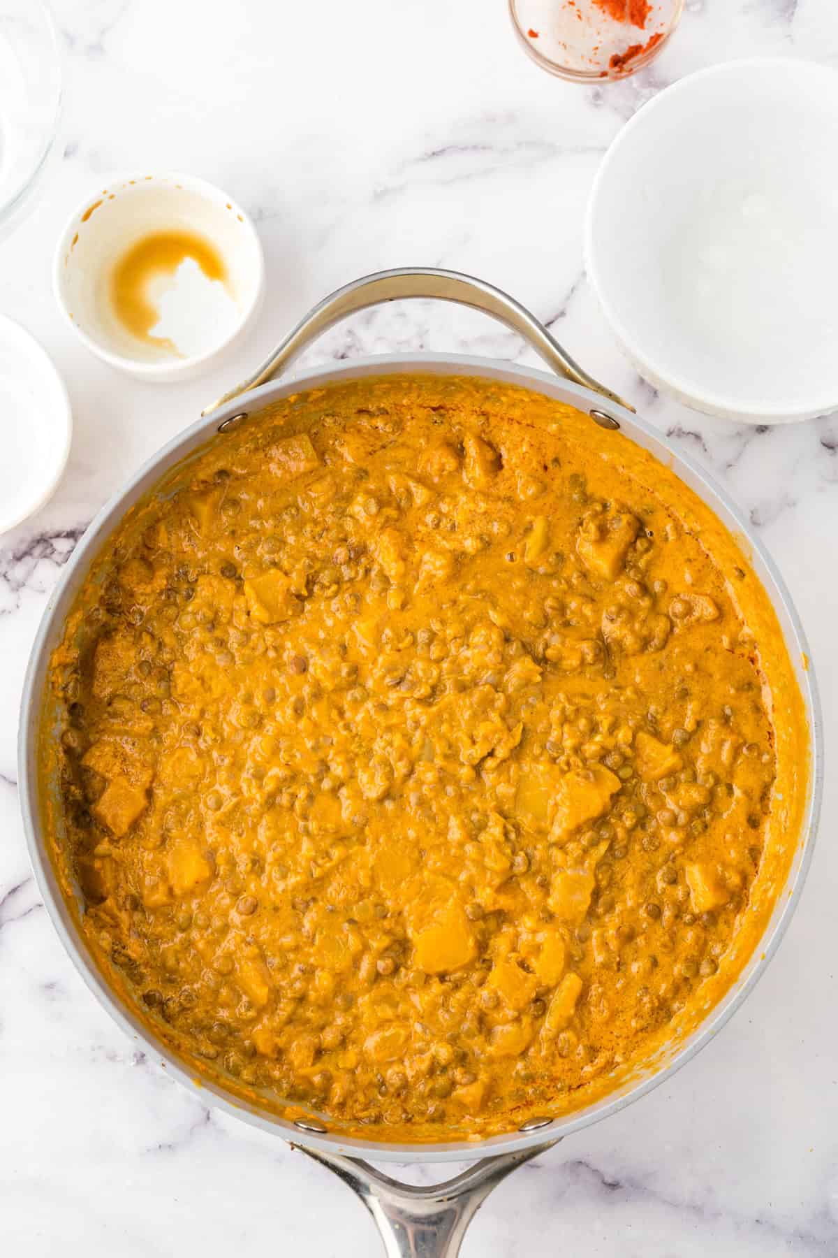 top view of lentil curry in a pan.