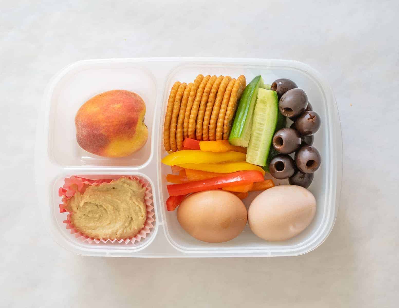 Quick and easy school and adult lunch box ideas made with Sabra Hummus, fruit, vegetables, and more.