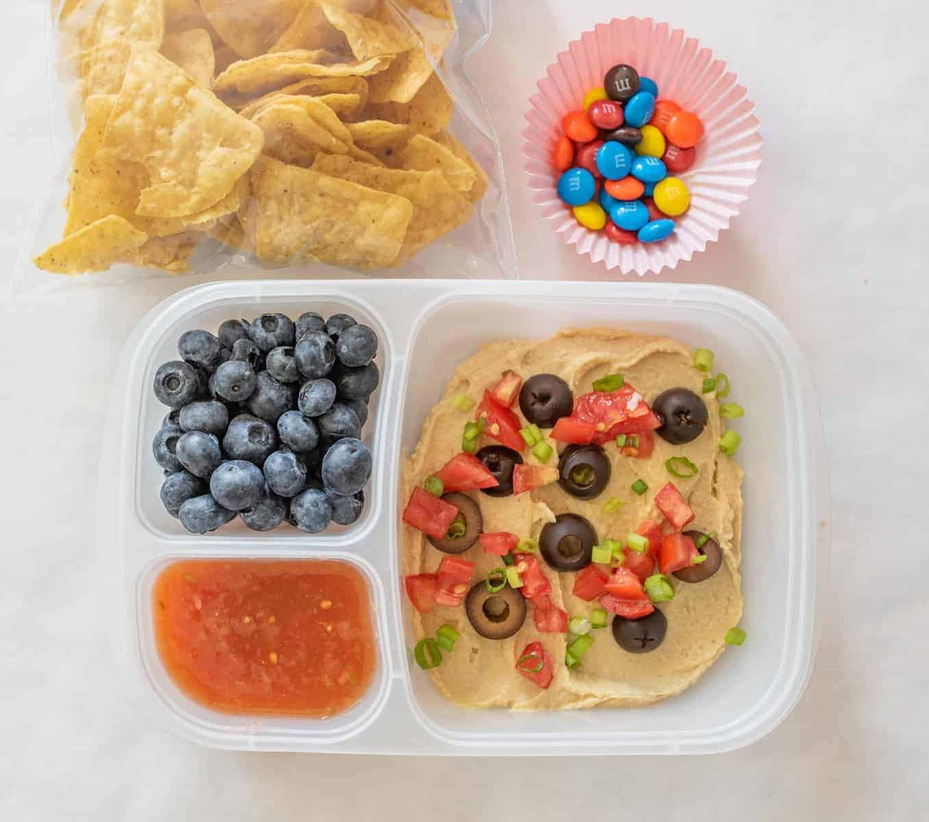 Quick and easy school and adult lunch box ideas made with Sabra Hummus, fruit, vegetables, and more.