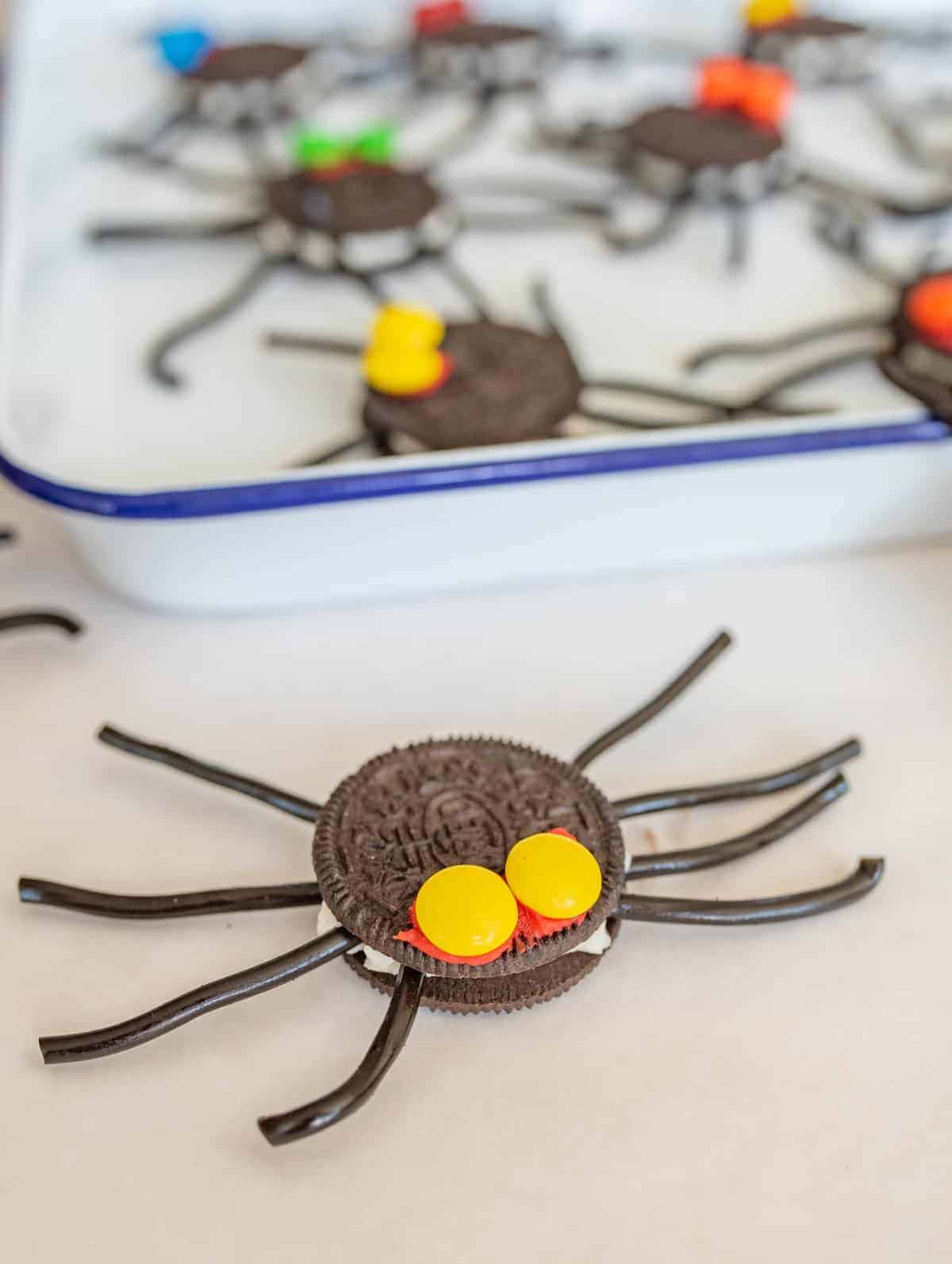 Easy Oreo Spider Halloween Snacks are made with cookies, licorice, and chocolate candies and make the perfect edible craft project.