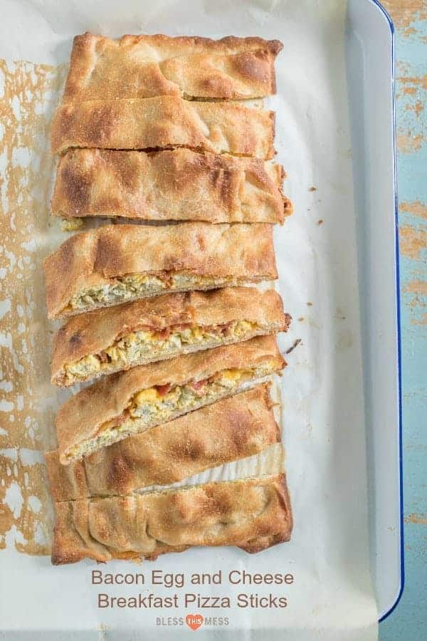 Sliced breakfast pizza sticks in a white baking dish lined with parchment paper