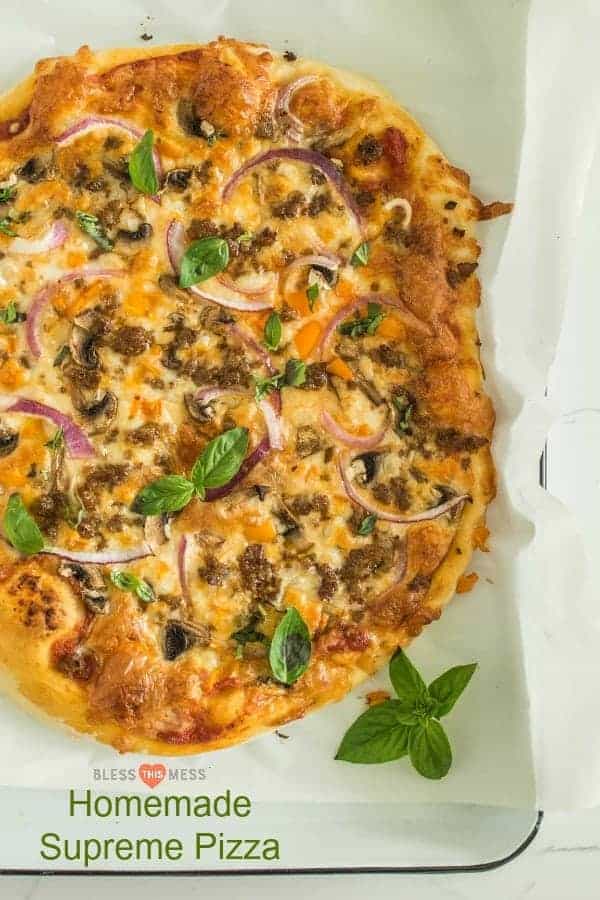 supreme pizza top view on a baking dish