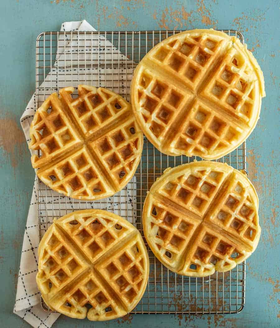 Top view of Belgian waffles on a cooling rack.
