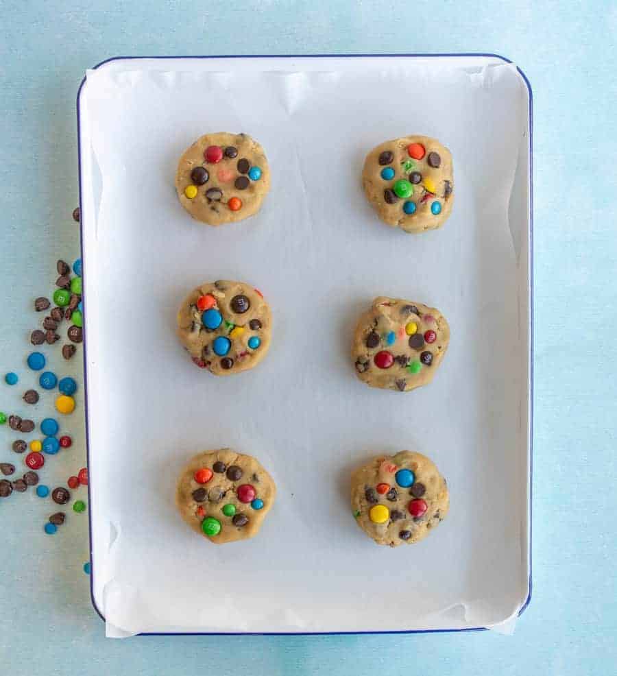 top view of parchment paper m&m cookie dough.