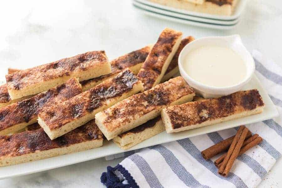 These warm, easy cinnamon sticks are SO good. They taste a lot like Pizza Hut’s cinnamon sticks, but not as greasy on the bottom.