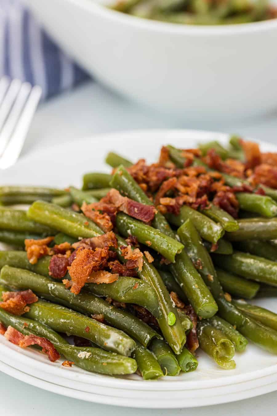 Green beans with butter and bacon is a hearty and flavor-filled side dish that takes green beans from plain to irresistible with just a handful of ingredients.