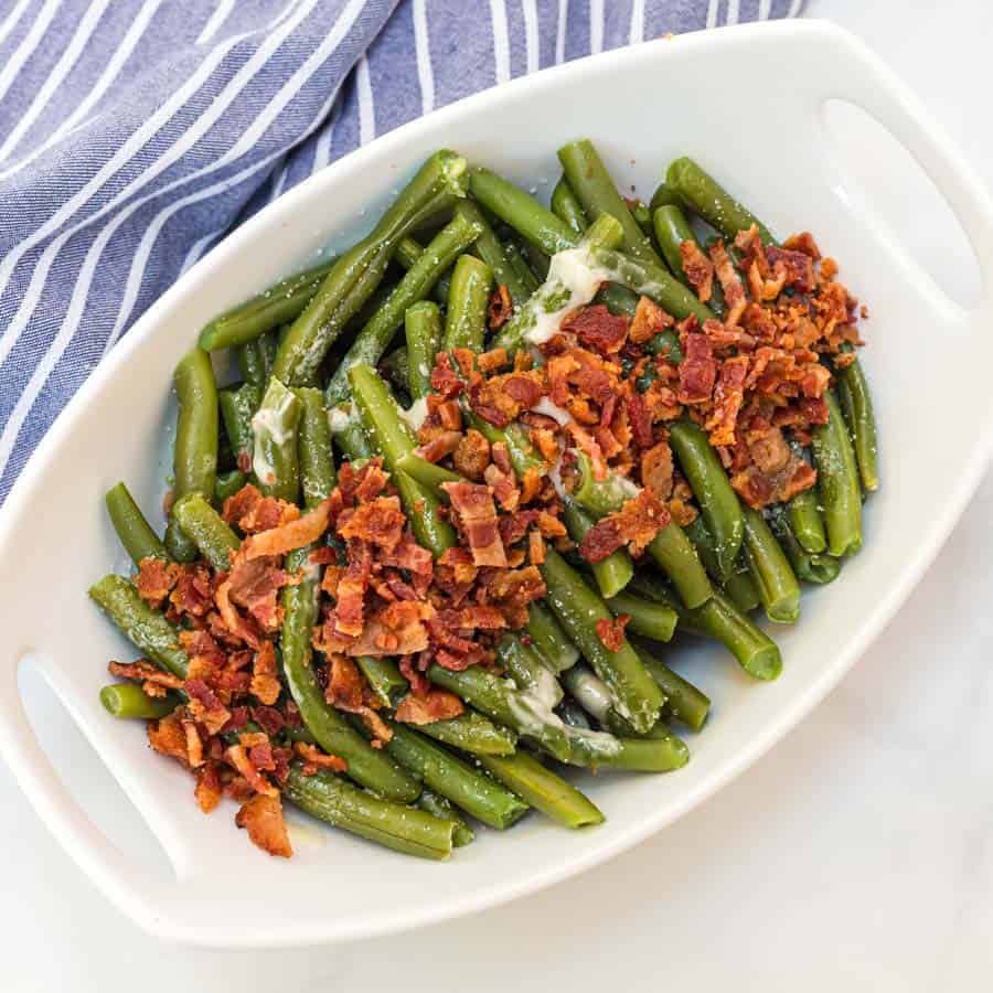 Green beans with butter and bacon is a hearty and flavor-filled side dish that takes green beans from plain to irresistible with just a handful of ingredients.