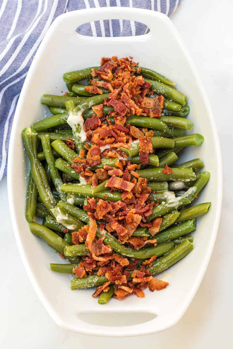 Green beans with butter and bacon is a hearty and flavor-filled side dish that takes green beans from plain to irresistible with just a handful of ingredients.
