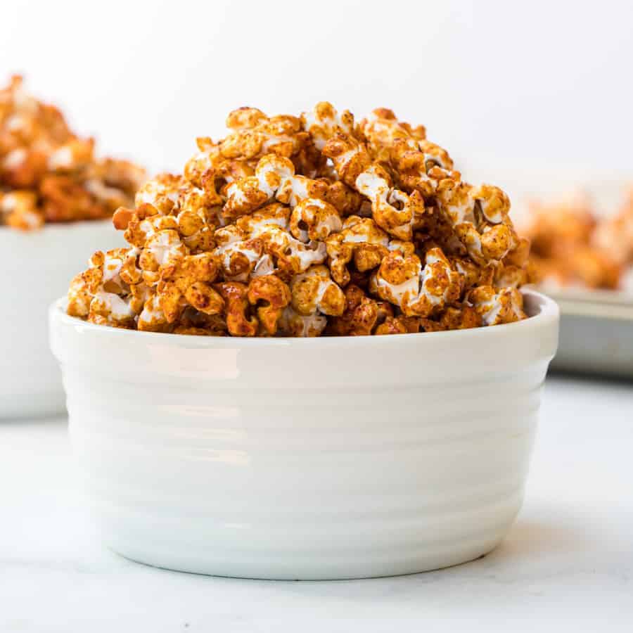 honey caramel corn in white bowls.