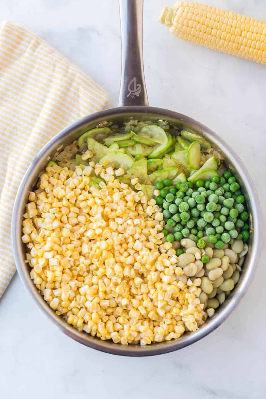 corn, squash, and bean side dish in a pot.