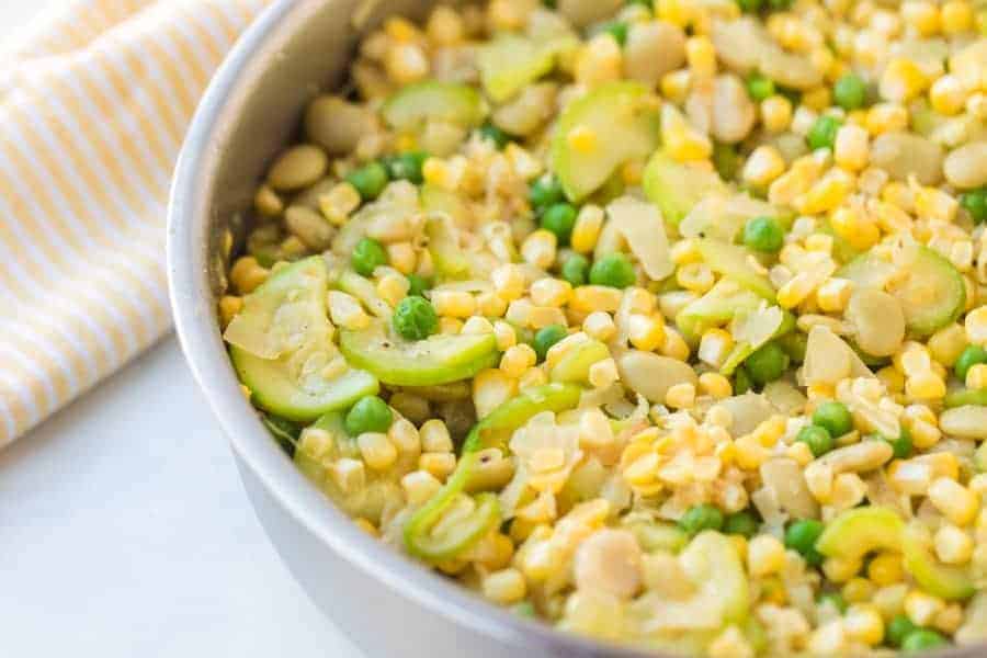 corn, squash, and bean side dish in a pot.