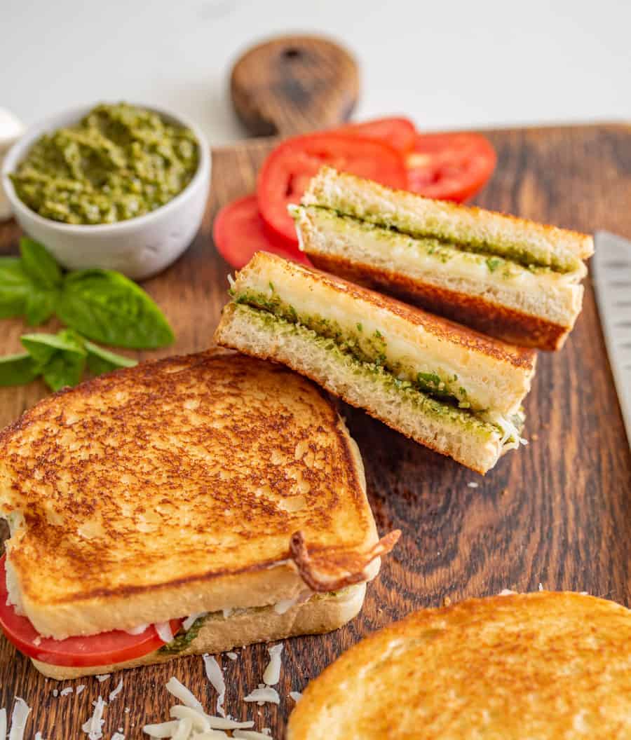 Pesto grilled cheese sandwiches are a super fun and delicious way to simply dress up the classic handheld lunch staple with tried-and-true flavors that taste heavenly together.
