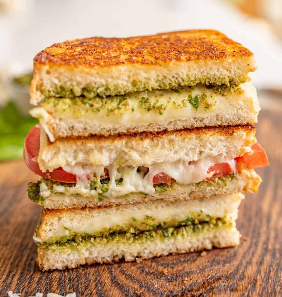 Pesto grilled cheese sandwiches are a super fun and delicious way to simply dress up the classic handheld lunch staple with tried-and-true flavors that taste heavenly together.