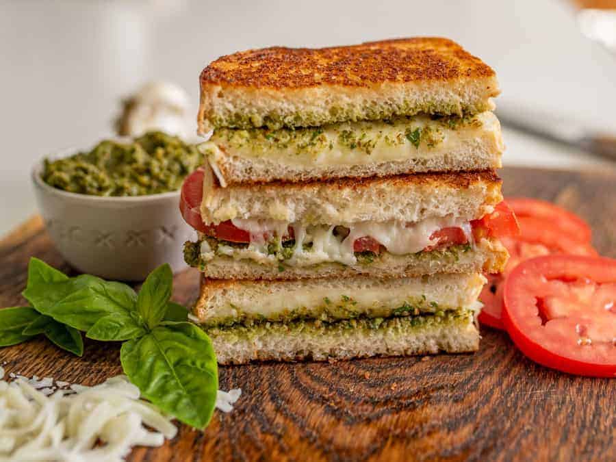 Pesto grilled cheese sandwiches are a super fun and delicious way to simply dress up the classic handheld lunch staple with tried-and-true flavors that taste heavenly together.