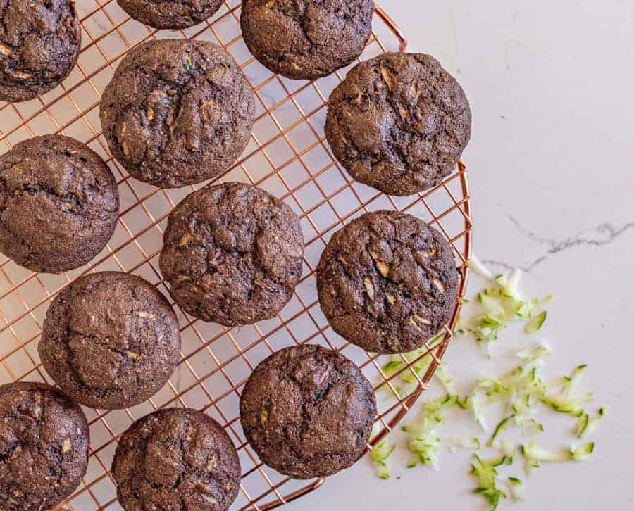 top view close up of chocolate zucchini muffins on a cooling rack.