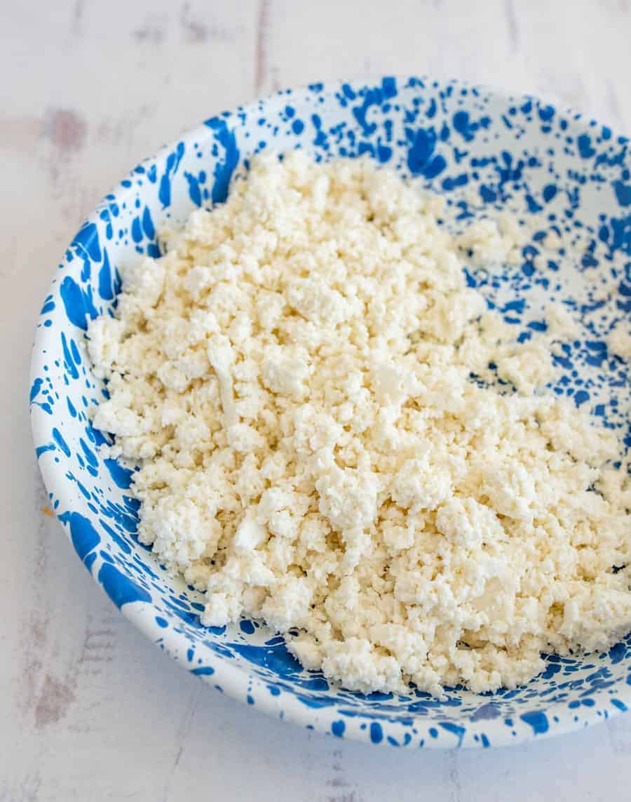 fresh cottage cheese on a blue speckled plate