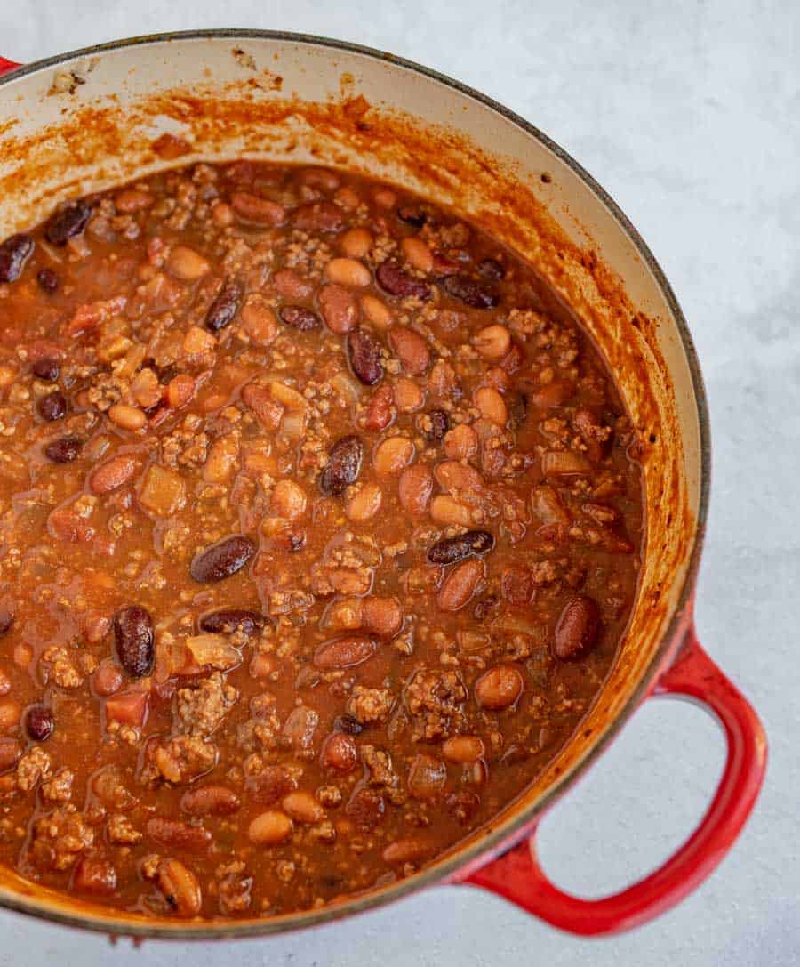 cooked chili in red pot ready to serve.