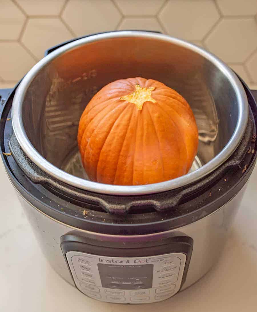 Small orange pumpkin in an instant pot.