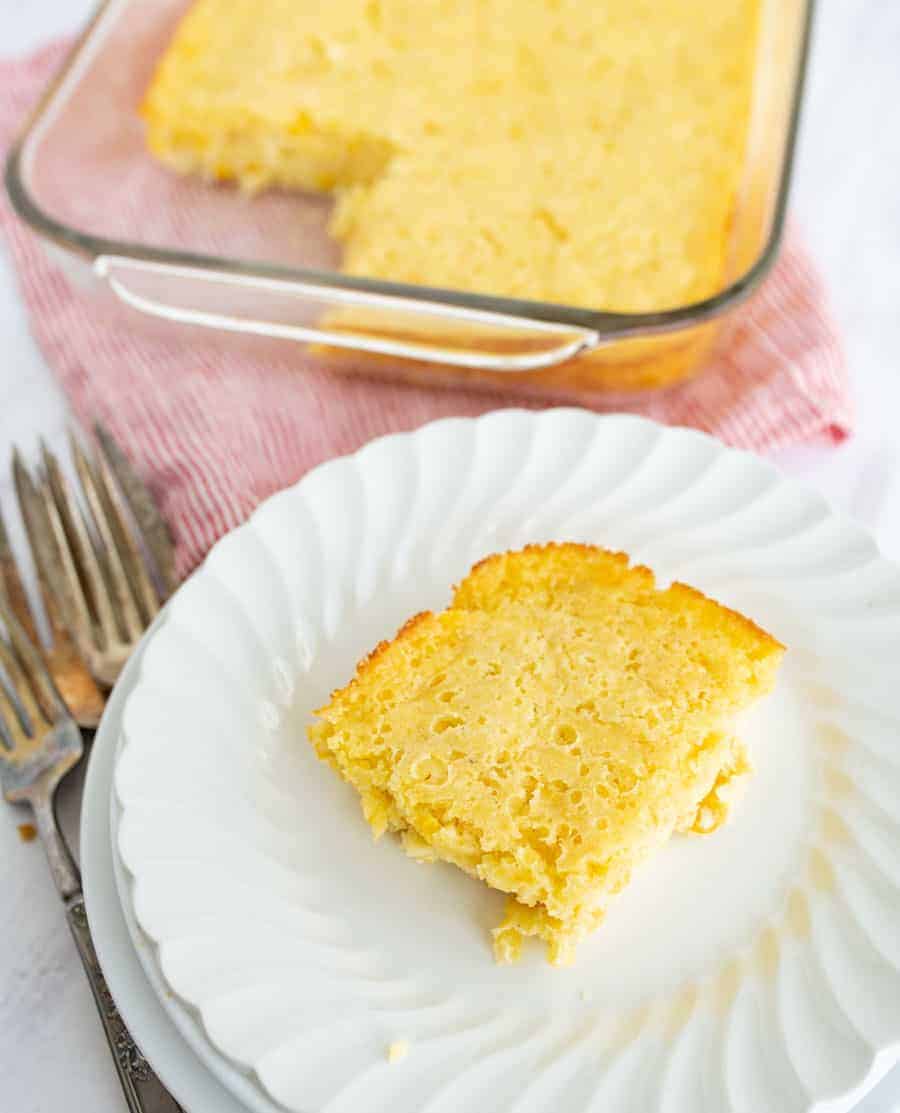 corn bread pudding on a white plate.