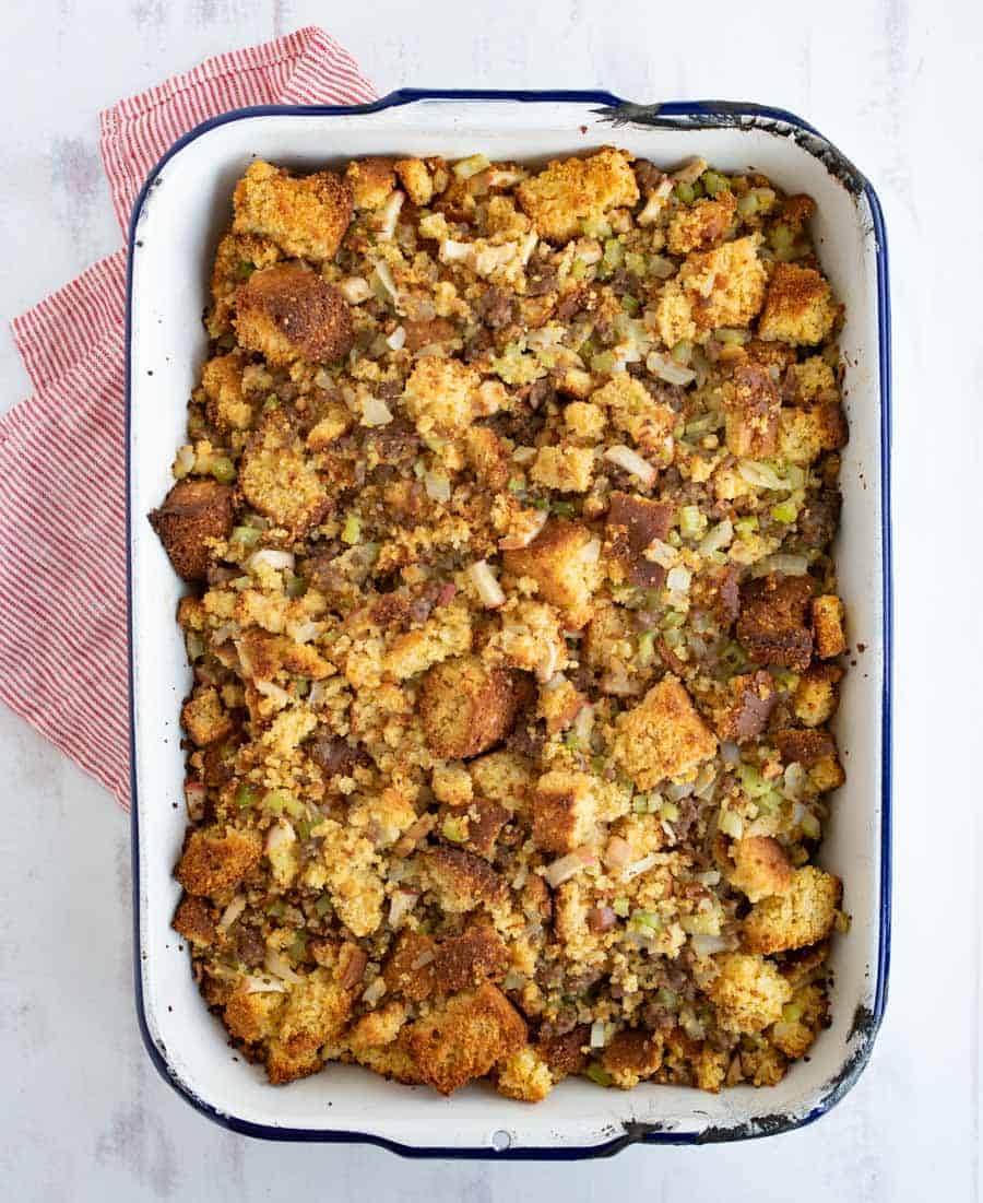 top view of close up of cornbread dressing in white dish.