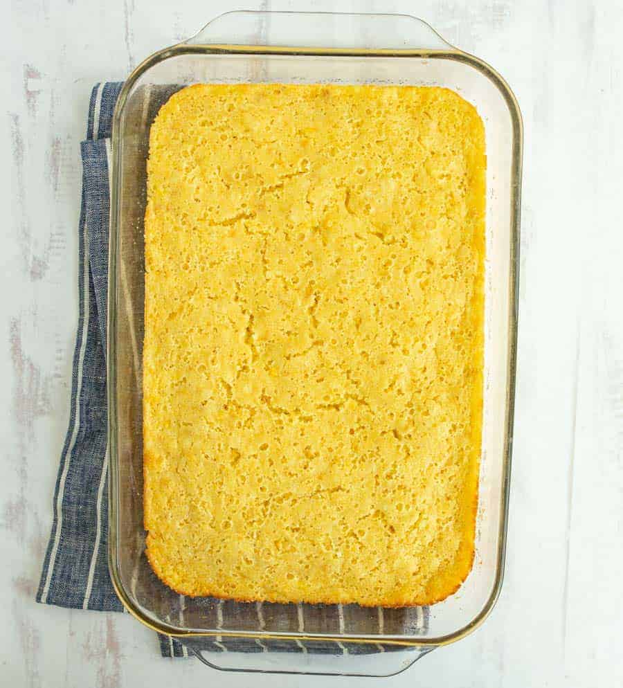 Creamed corn casserole in a glass baking dish.
