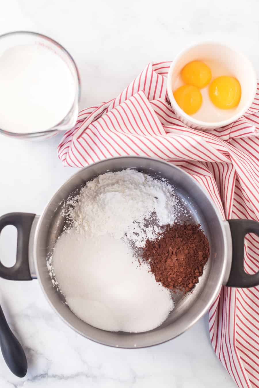 chocolate pudding recipe ingredients in mixing bowl.