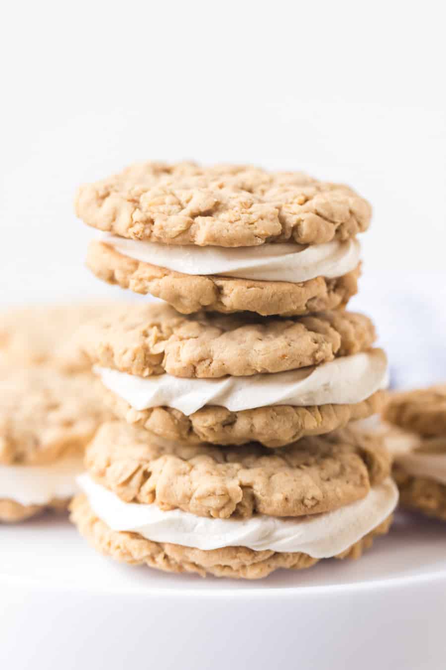 stack of homemade oatmeal sandwich cookies with white background.