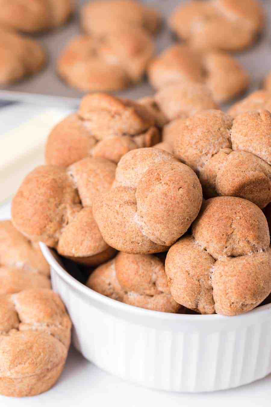 rolls in the clover shape overflowing from a while bowl.