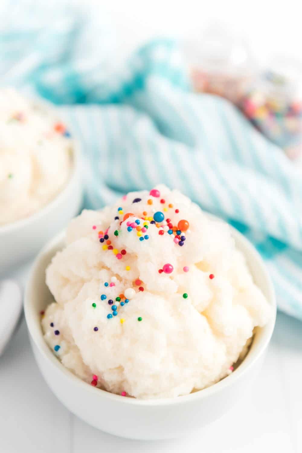Top view of a snow ice cream in a dish with colored sprinkles.