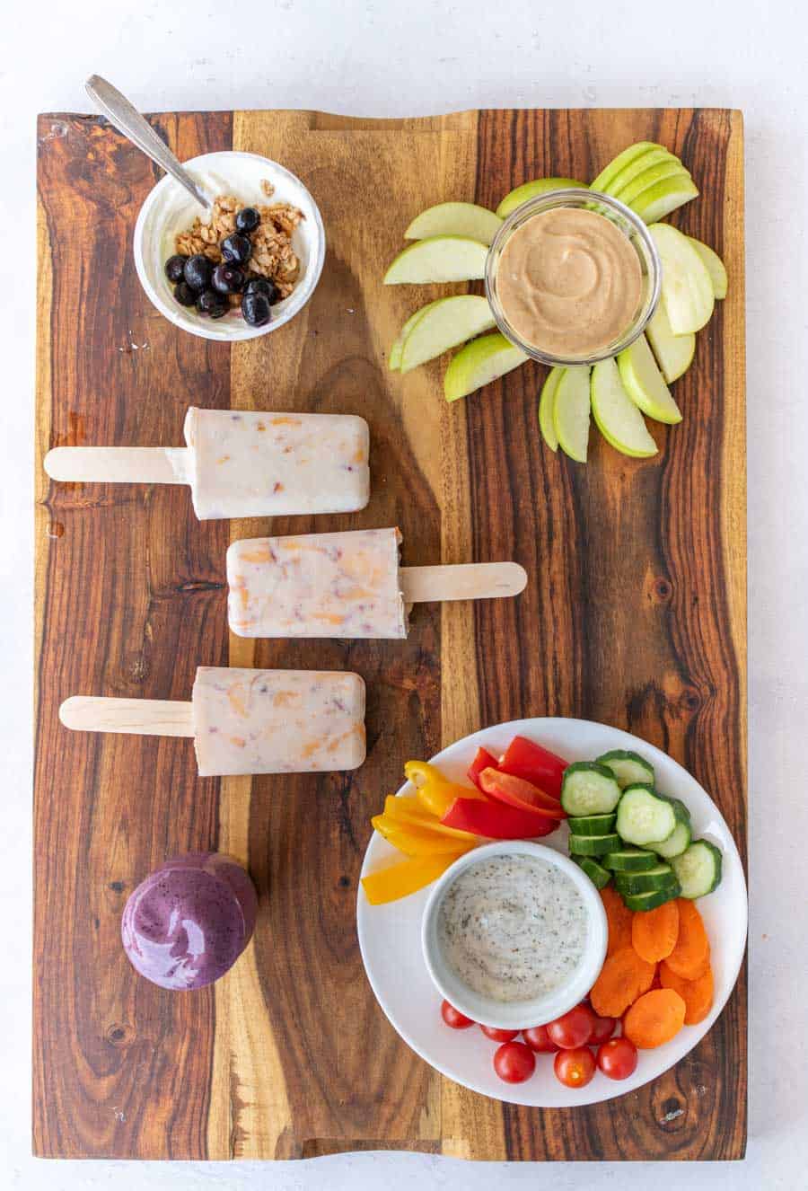 Healthy snacks on a wooden board.