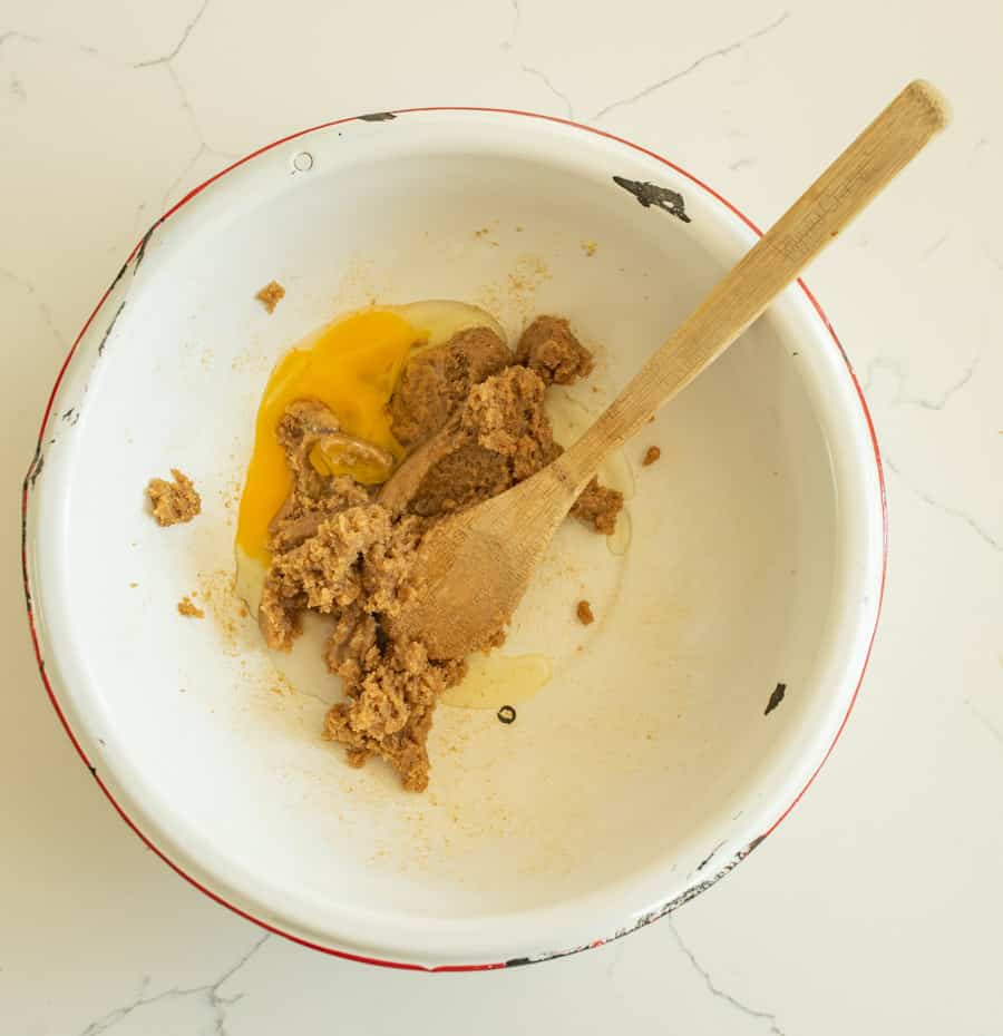 egg and butter and brown sugar in bowl.