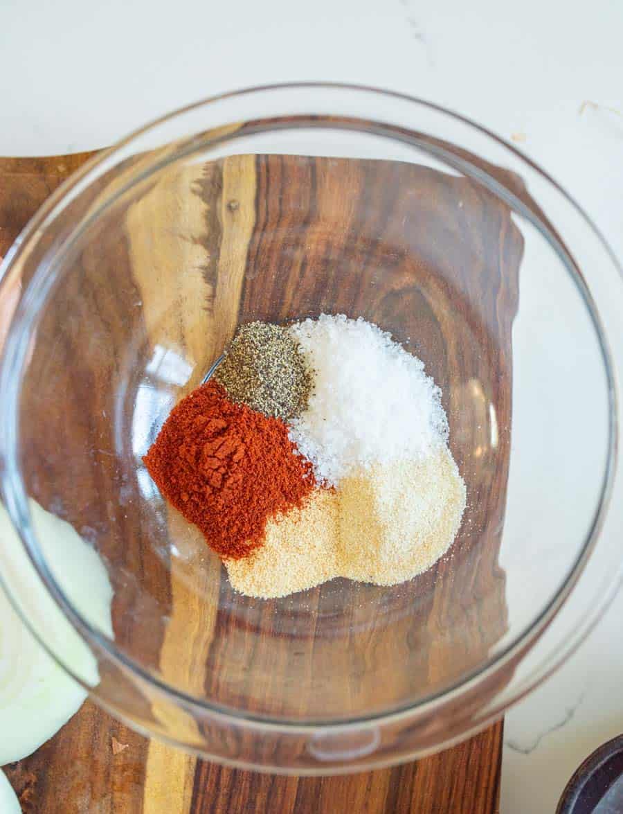 Clear glass bowl with the seasoning for the recipe in it.